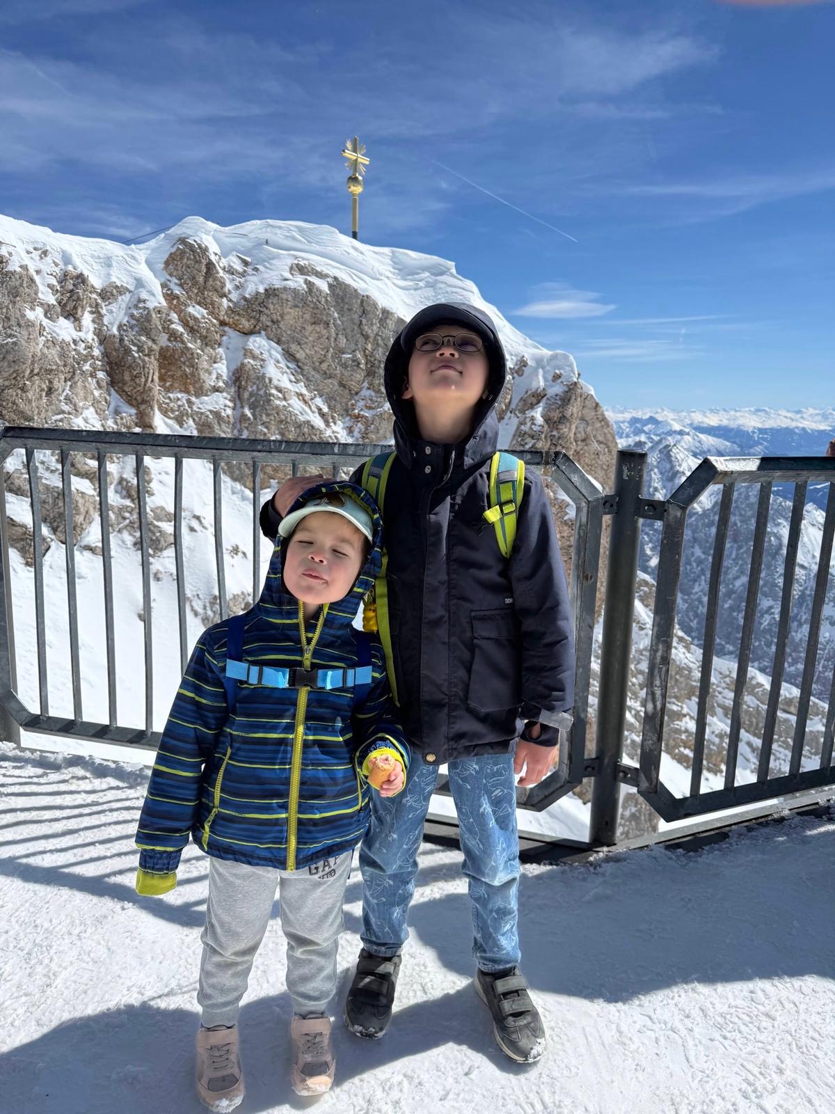 Our children at the summit viewpoint on Zugspitze, where the views were huge but the stop worked best as a short one.