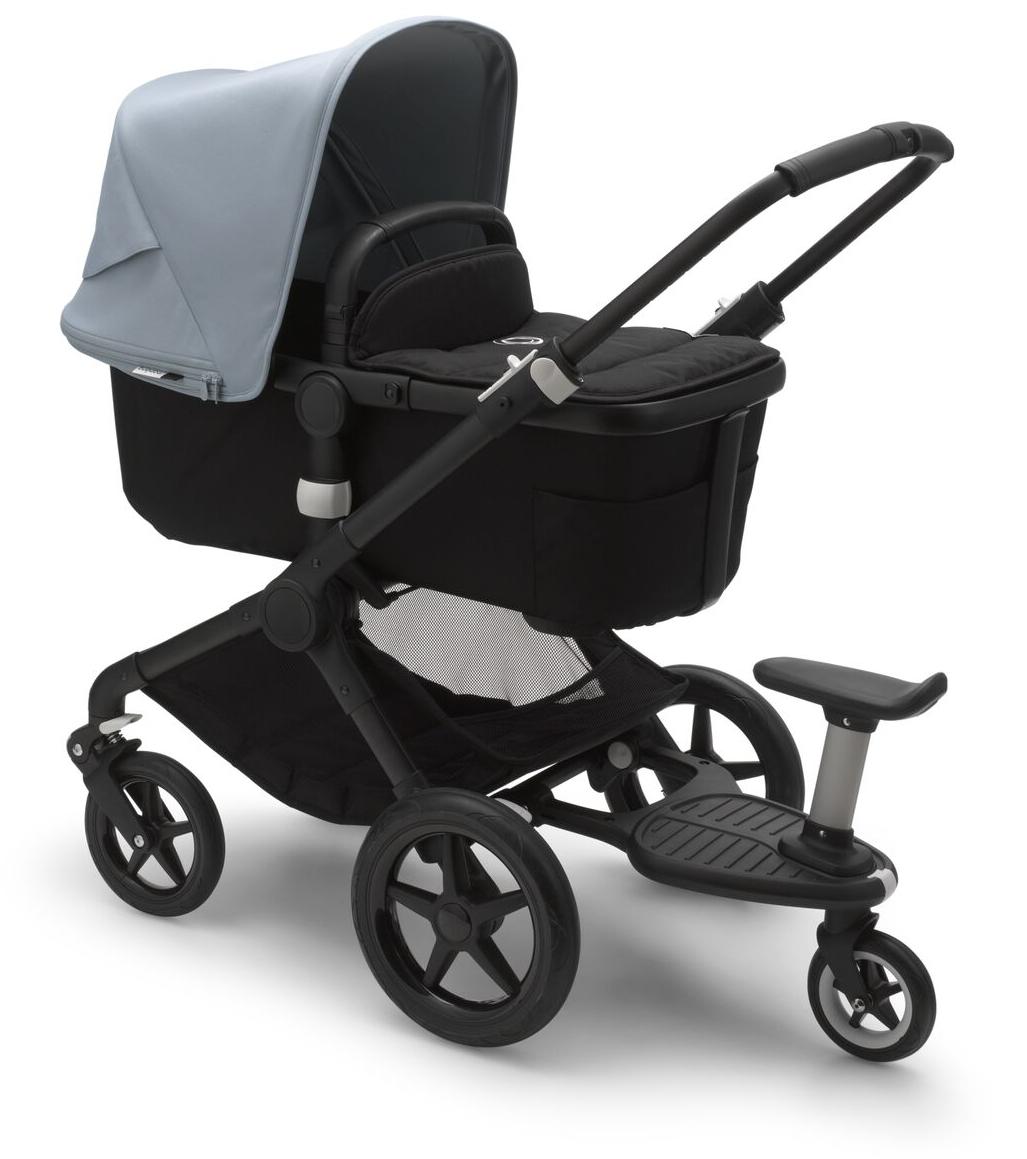 A Bugaboo Fox 2 with a wheeled board. While Bugaboo Fox can’t be transformed to a dual stroller, it can transport two children if the year gap is great enough.
