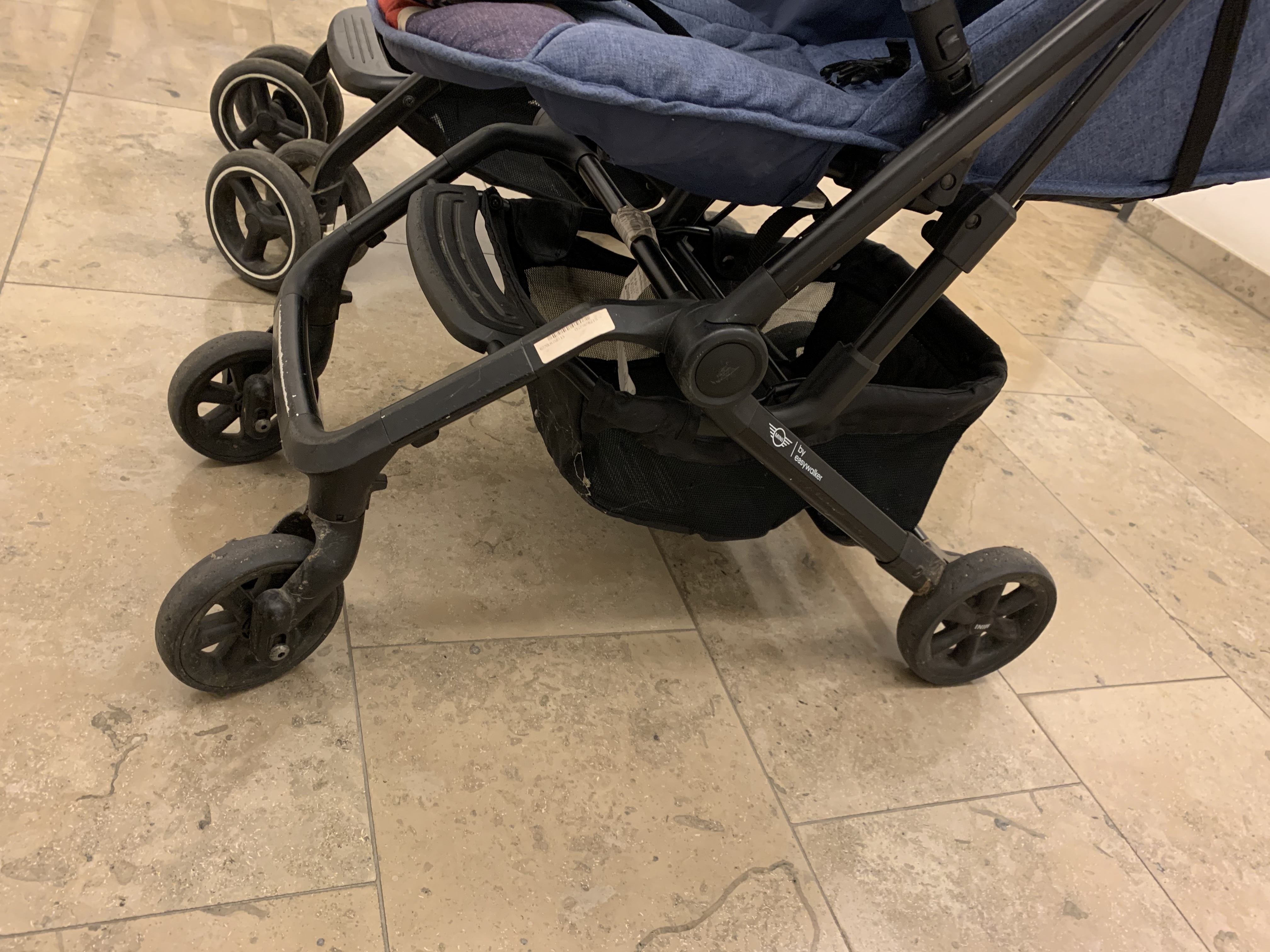 The Easywalker Buggy XS lower frame and wheels in close-up, showing the lighter, slimmer travel-buggy construction.