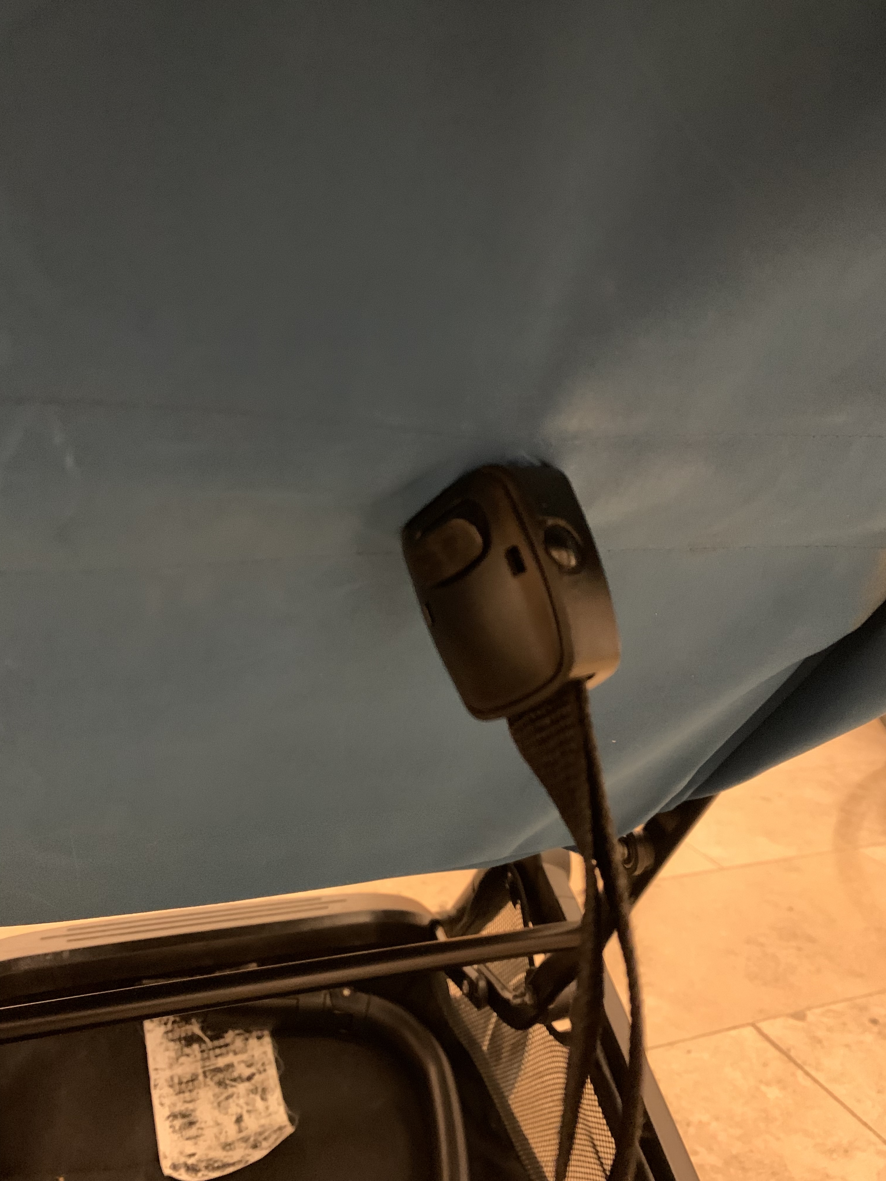 Another close-up of the seat recline strap and buckle, worth checking because a worn adjuster can make the backrest harder to set securely.