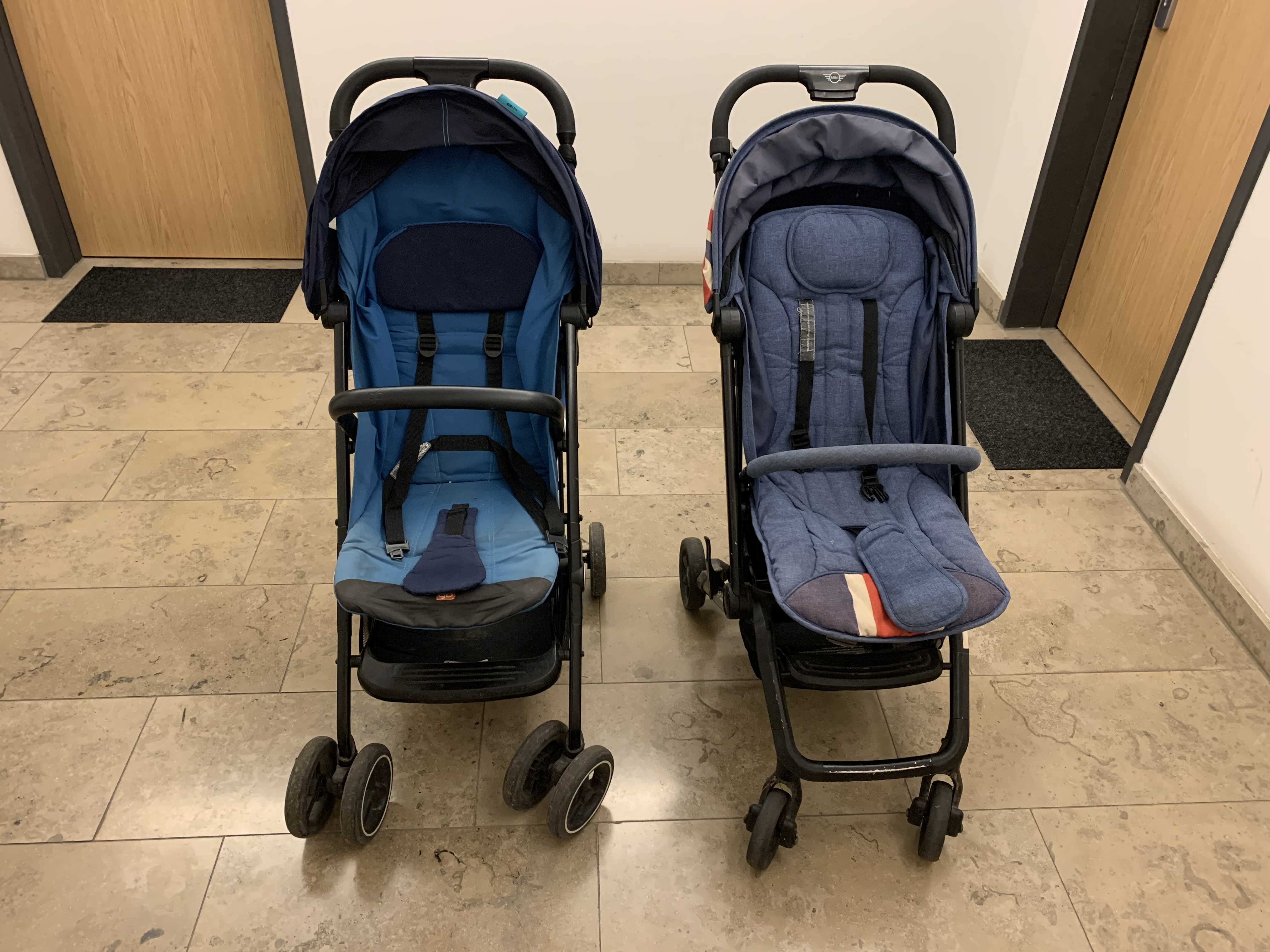 The seats of the GB Qbit+ and Easywalker Buggy XS side by side, with both canopies partly open.