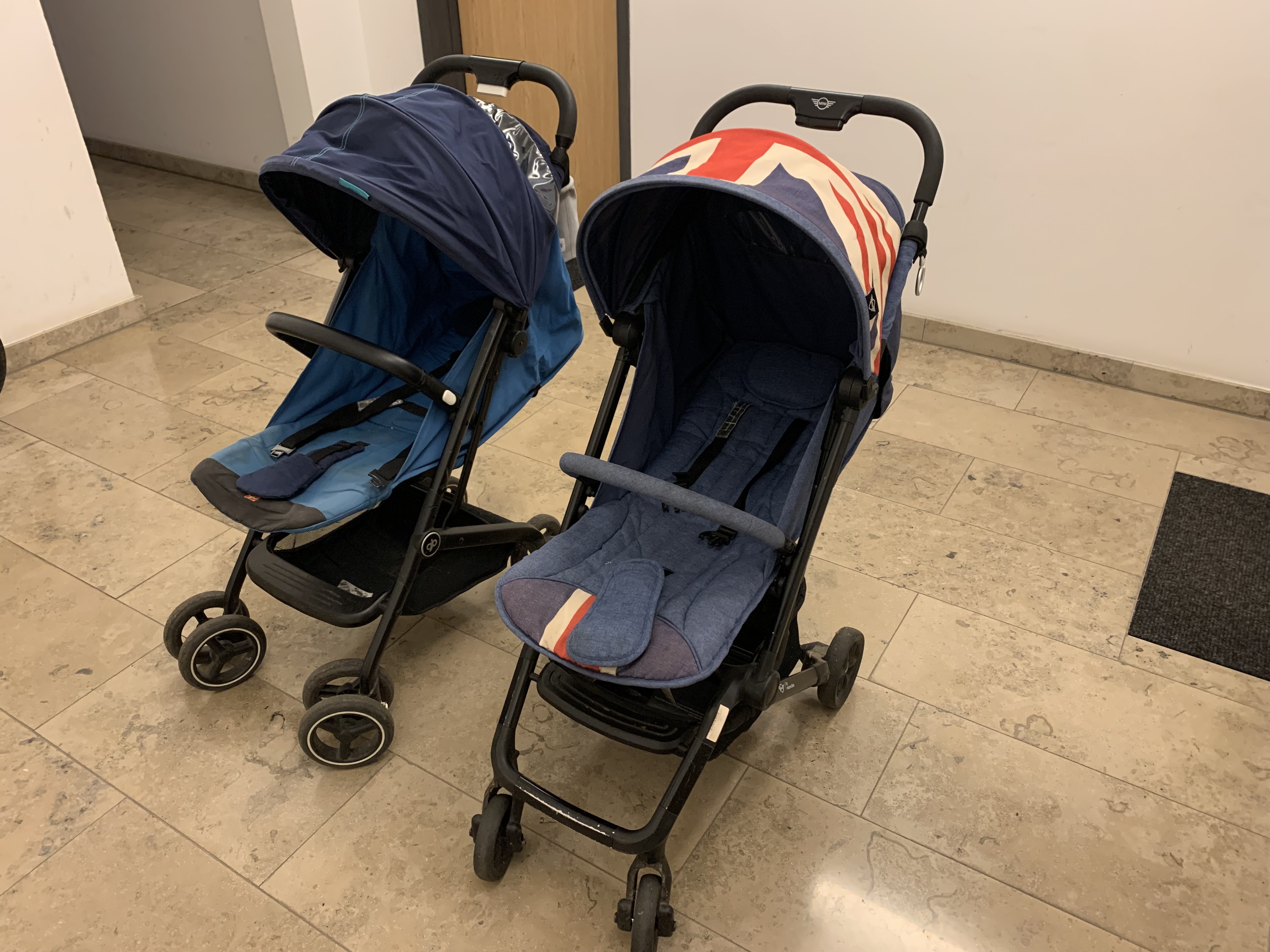 The GB Qbit+ and Easywalker Buggy XS at an angle, showing the Easywalker’s slimmer frame and the GB Qbit+’s more built-up lower structure.