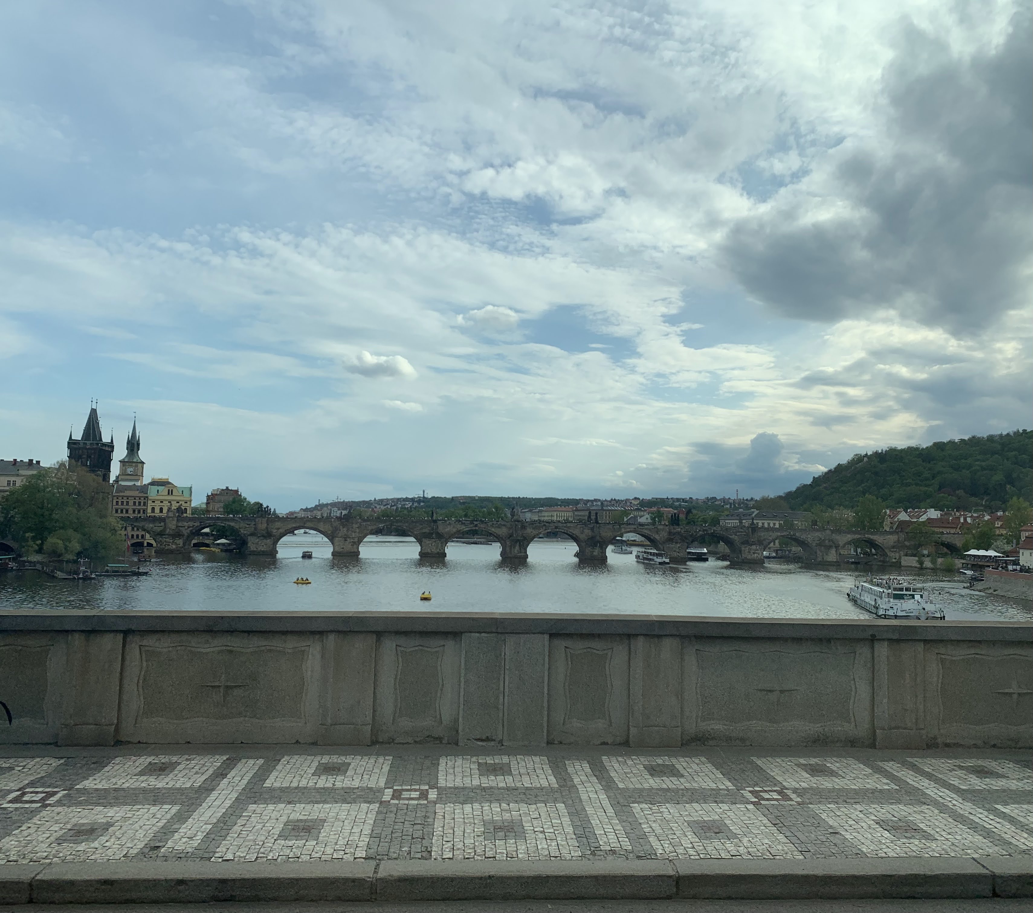 A view toward Charles Bridge and the river, where the route opened up after the denser castle and old-town lanes.