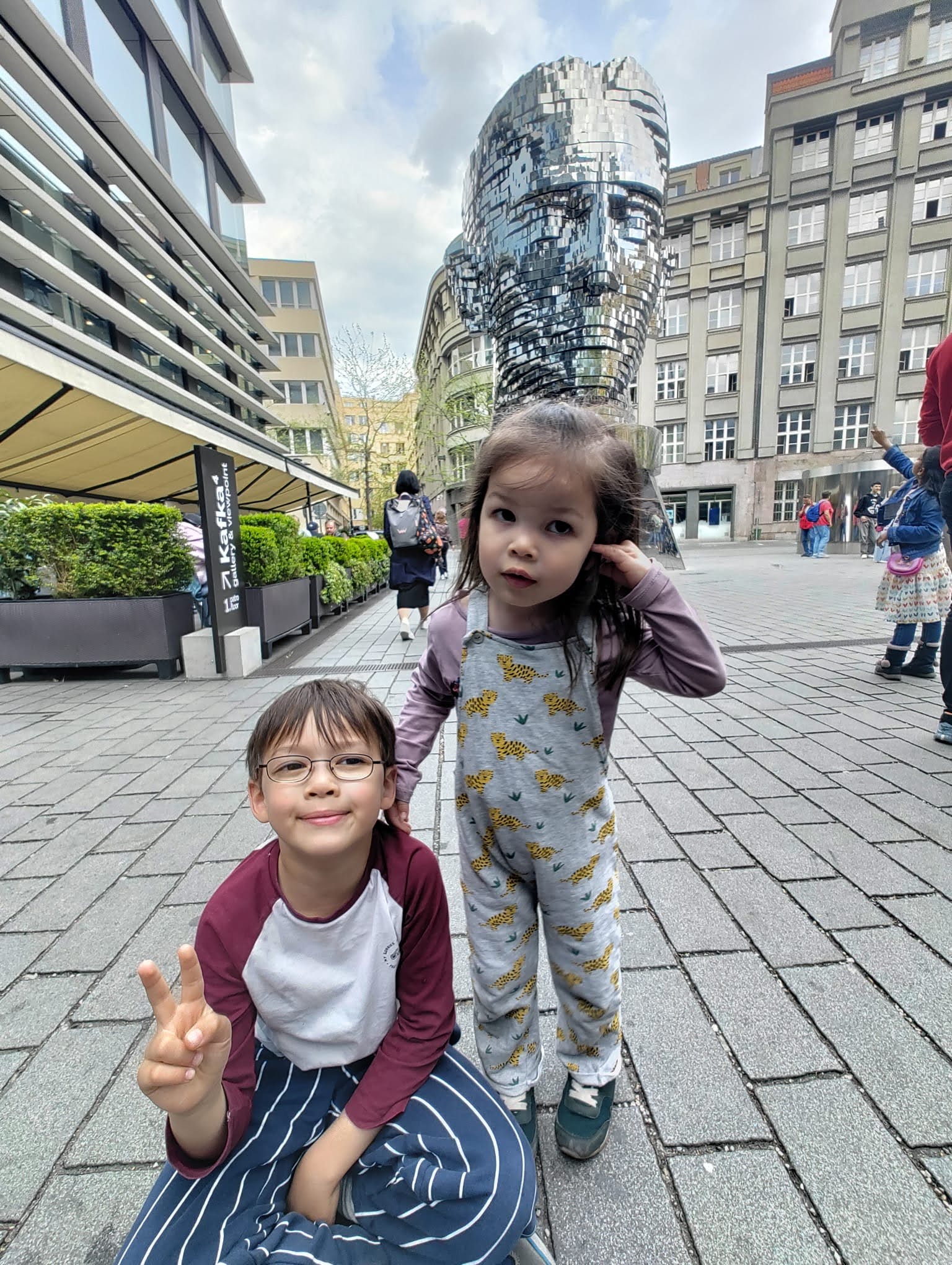 Our children near the rotating Kafka head sculpture in Prague’s newer center.