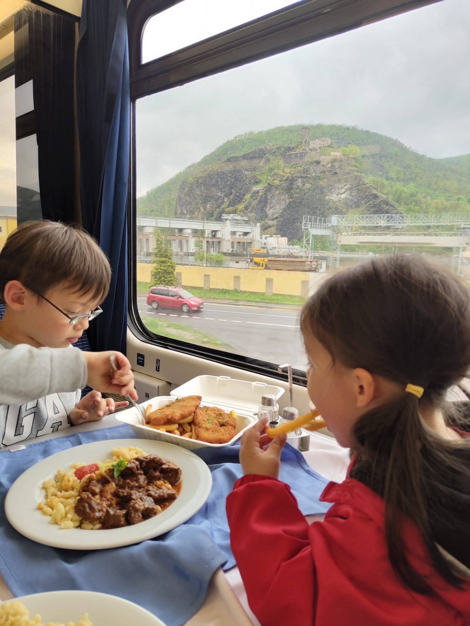The children eating in the train dining car on the way back from Prague to Berlin.
